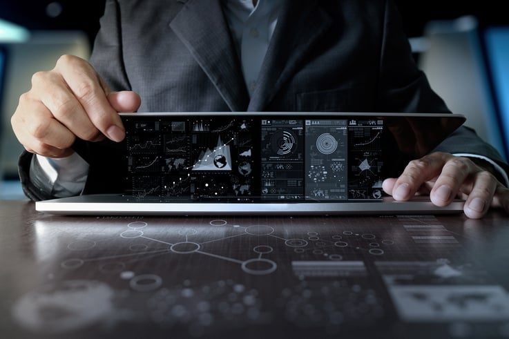 business man hand working on laptop computer with digital layer business strategy and social media diagram on wooden desk